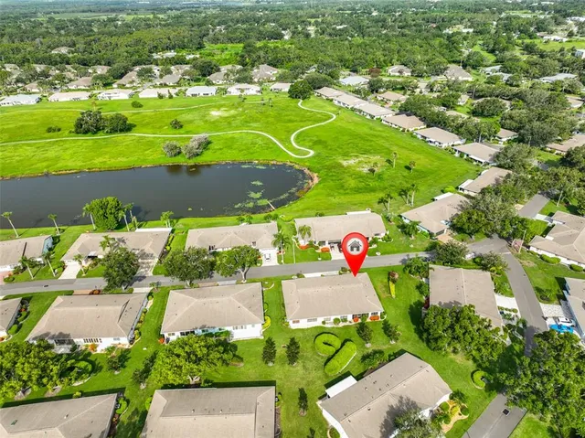 an aerial view of a pool yard swimming pool and outdoor seating