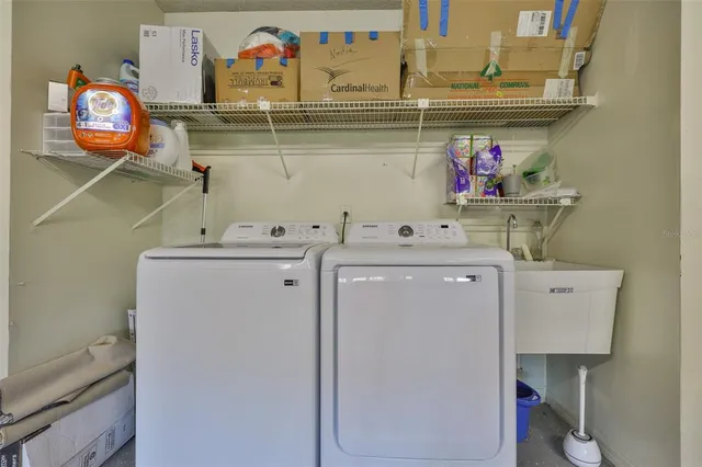 a utility room with dryer and washer