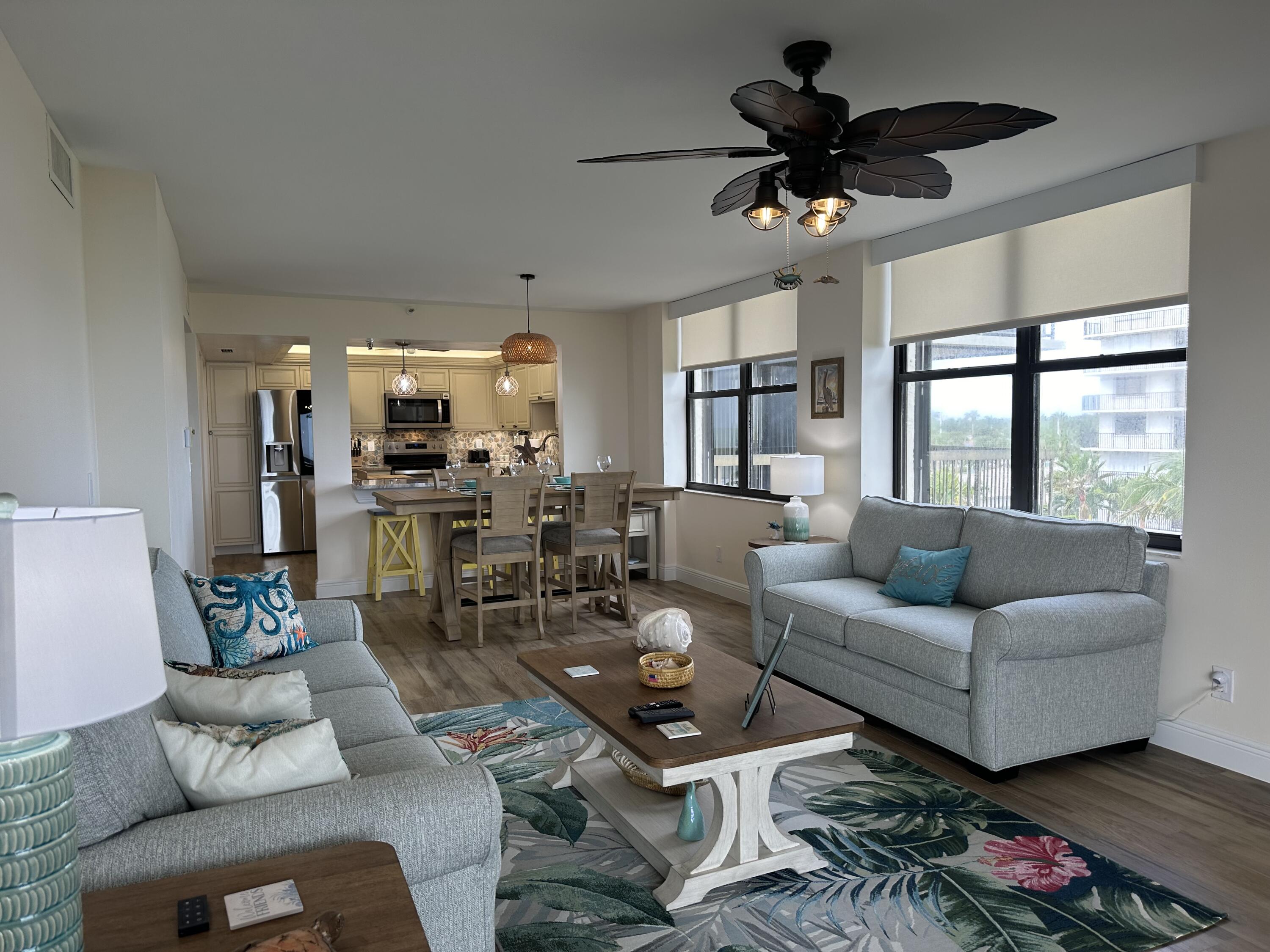 3100 North Hwy A1A, Unit 502 Fort Pierce, FL 34949 - Photo 13 of 44 a living room with furniture and a large window