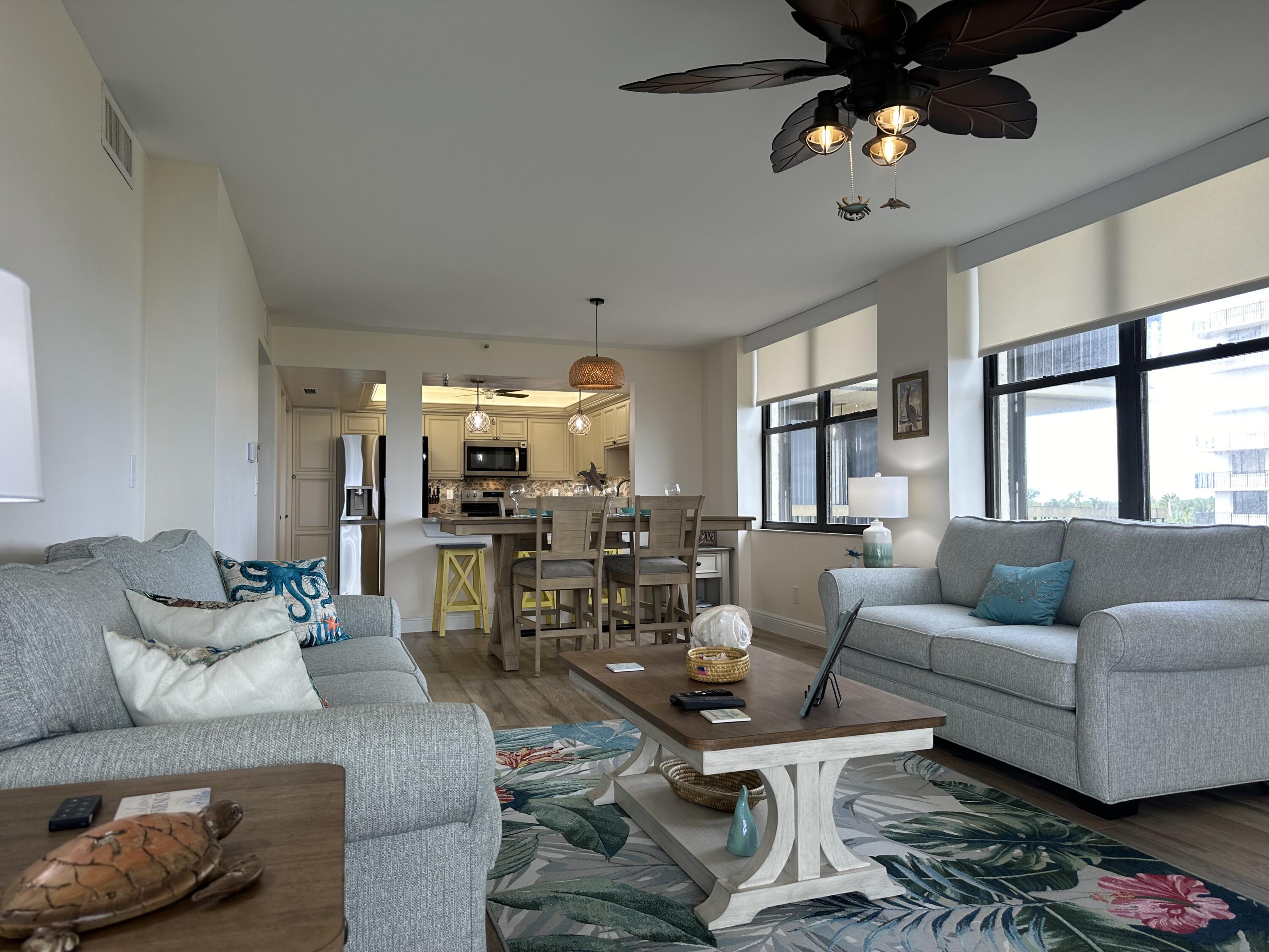 3100 North Hwy A1A, Unit 502 Fort Pierce, FL 34949 - Photo 14 of 44 a living room with furniture and a large window