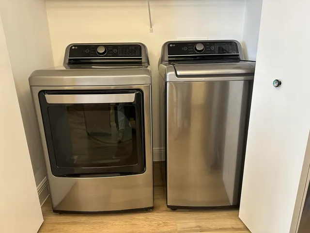 a balcony with chairs and wooden floor