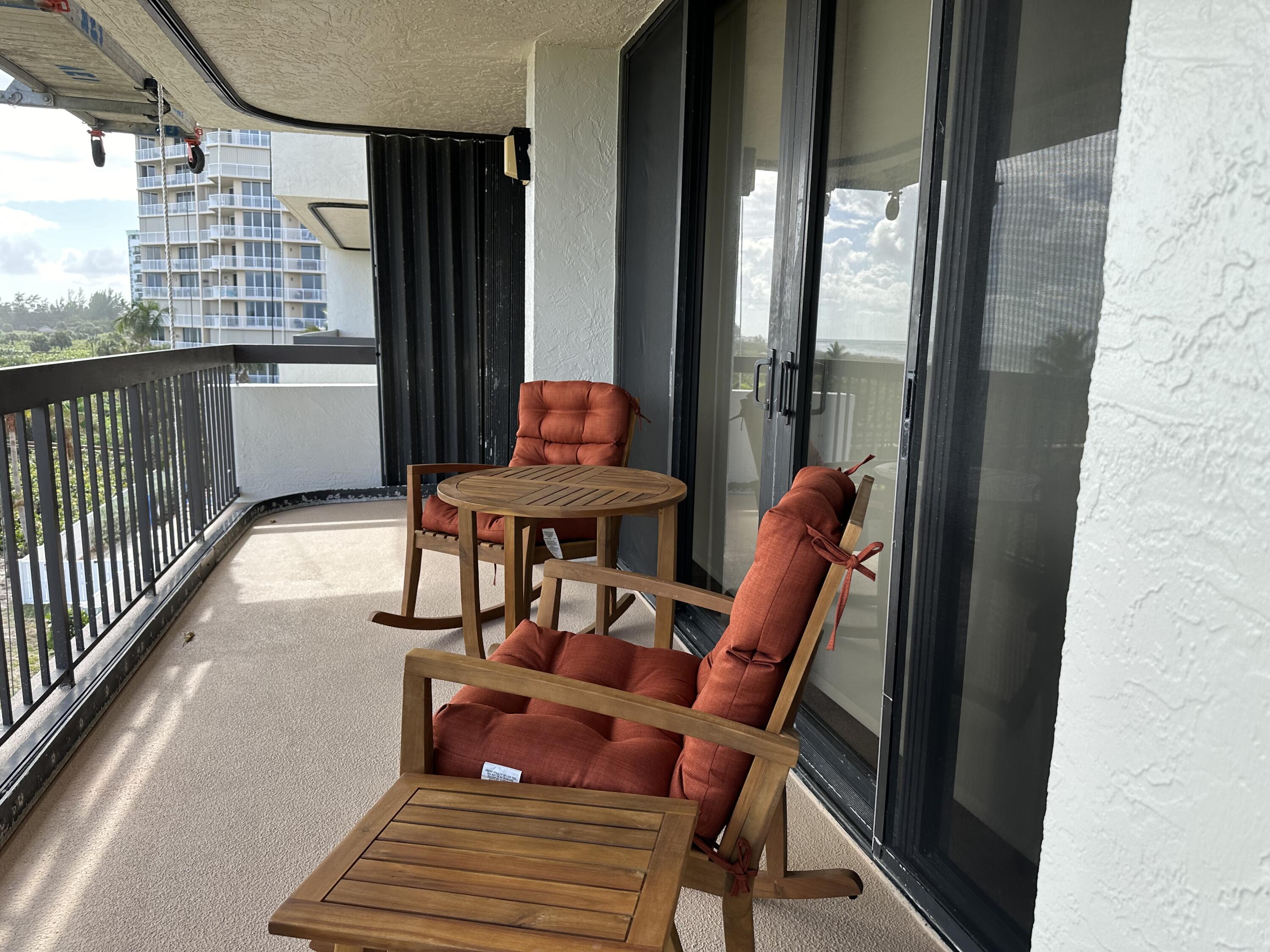 3100 North Hwy A1A, Unit 502 Fort Pierce, FL 34949 - Photo 33 of 44 a outdoor space with chairs