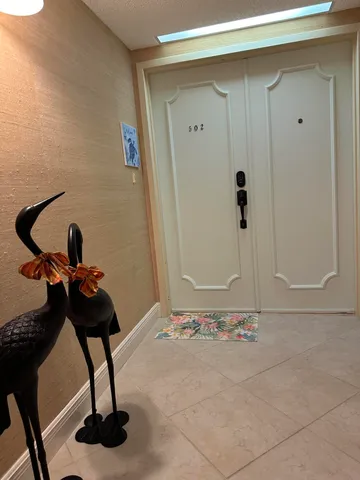 a front view of a building with garden