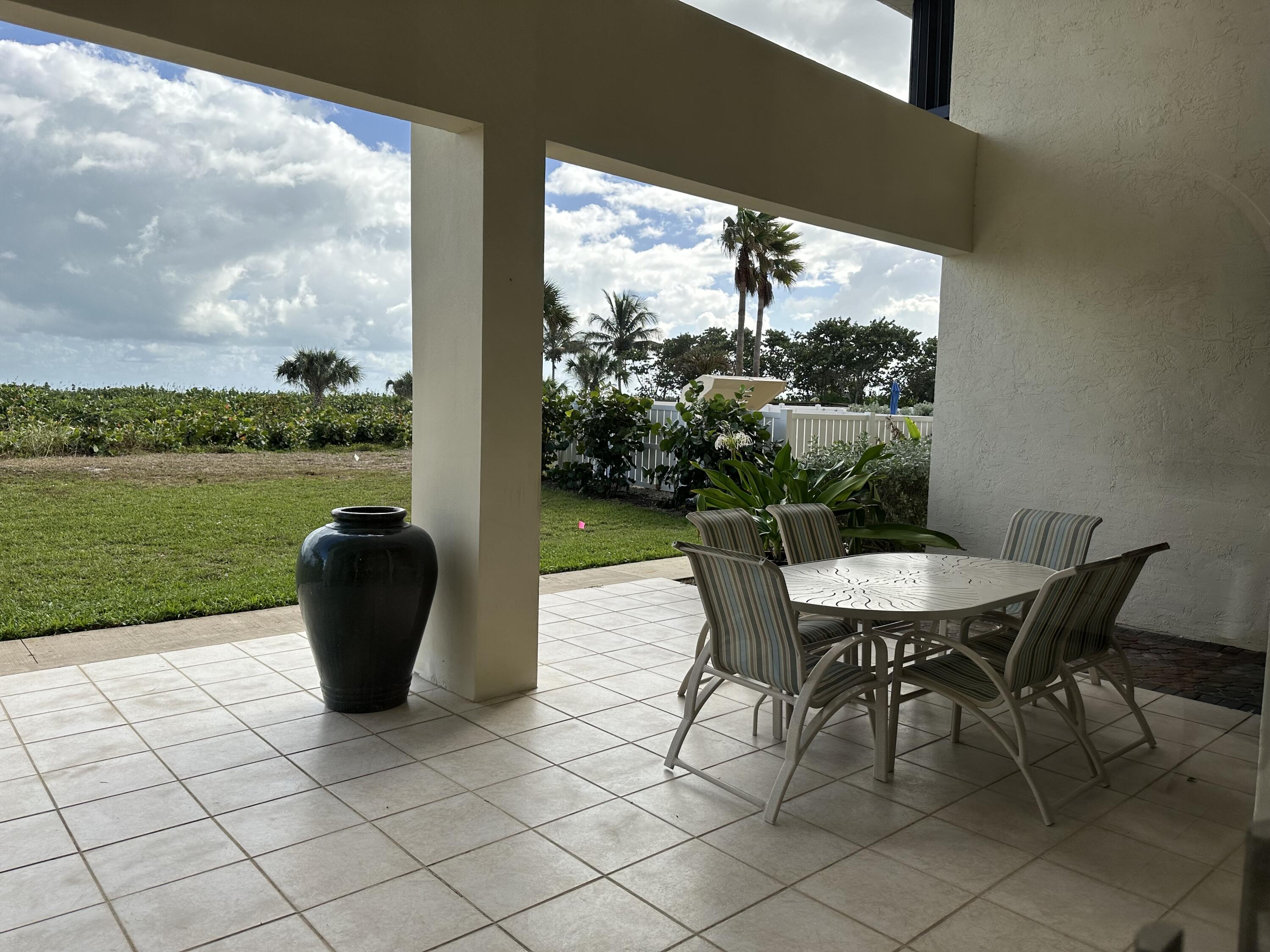 3100 North Hwy A1A, Unit 502 Fort Pierce, FL 34949 - Photo 40 of 44 a view of a porch with furniture and garden