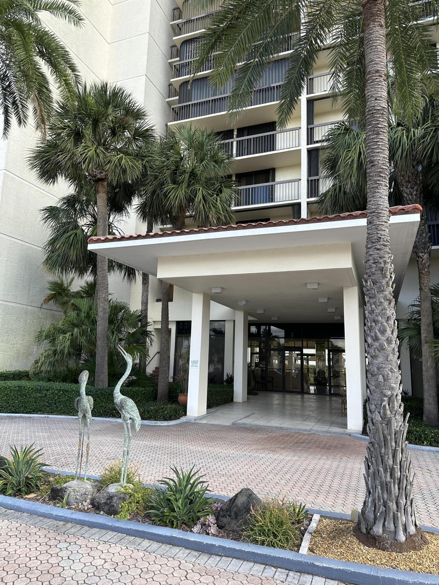 3100 North Hwy A1A, Unit 502 Fort Pierce, FL 34949 - Photo 43 of 44 a front view of a building with garden
