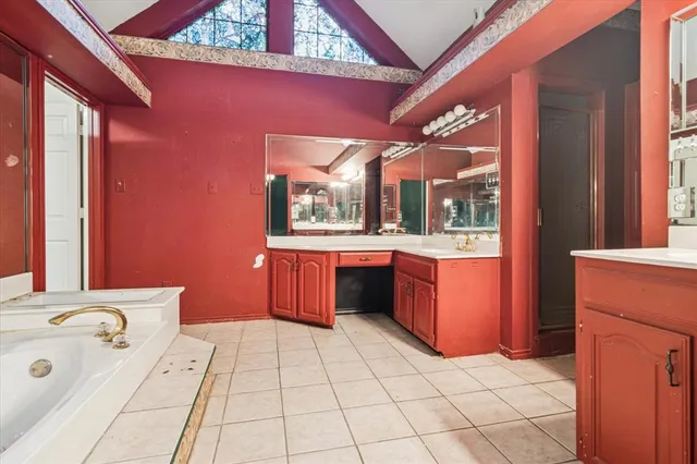 a bathroom with a sink a mirror and a bathtub