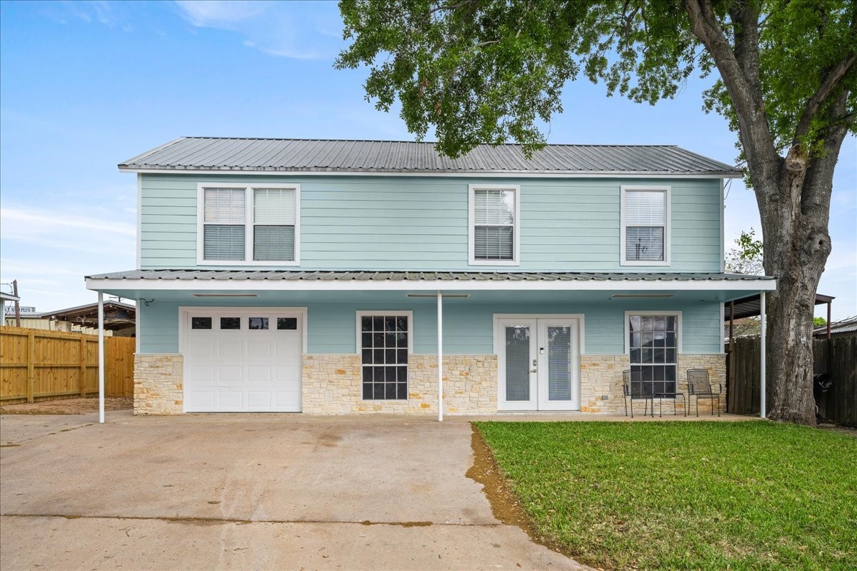 103 Emile Street Brenham, TX 77833 - Photo 1 of 22 front view of a house with a yard