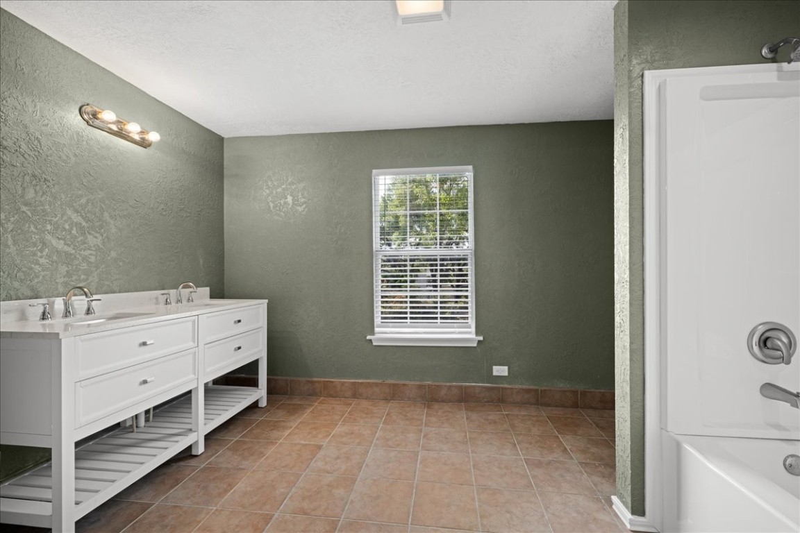 103 Emile Street Brenham, TX 77833 - Photo 14 of 22 a room with painting and windows