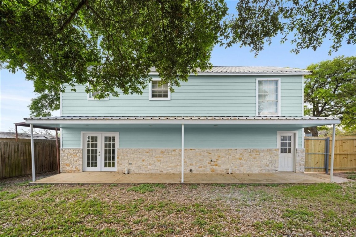 103 Emile Street Brenham, TX 77833 - Photo 18 of 22 a front view of a house with a garden