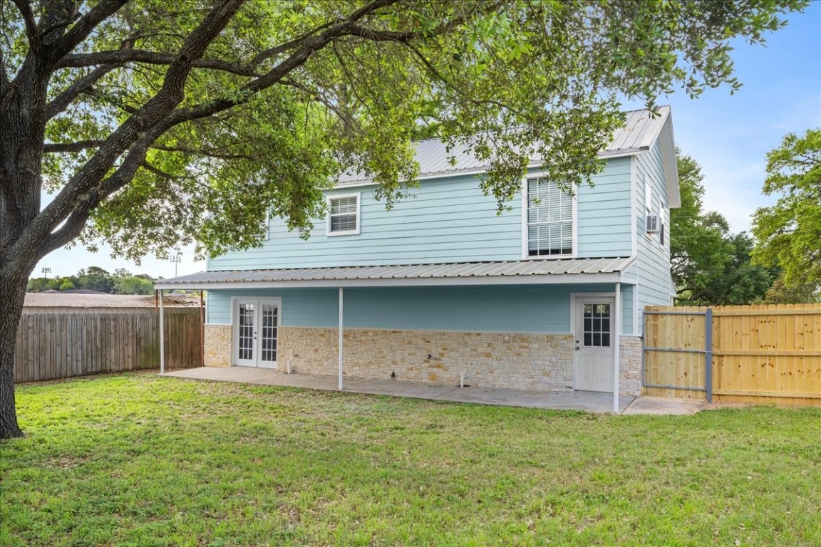 103 Emile Street Brenham, TX 77833 - Photo 20 of 22 a front view of a house with a garden