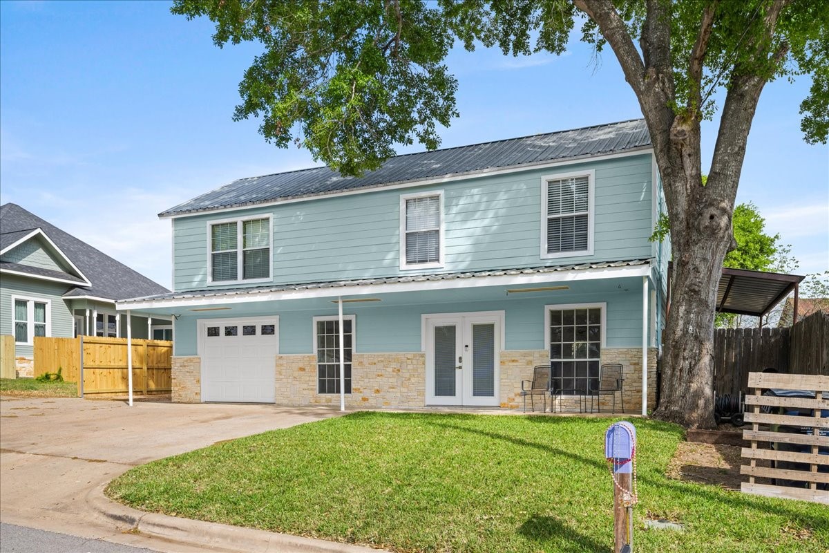 103 Emile Street Brenham, TX 77833 - Photo 3 of 22 front view of a house with a yard