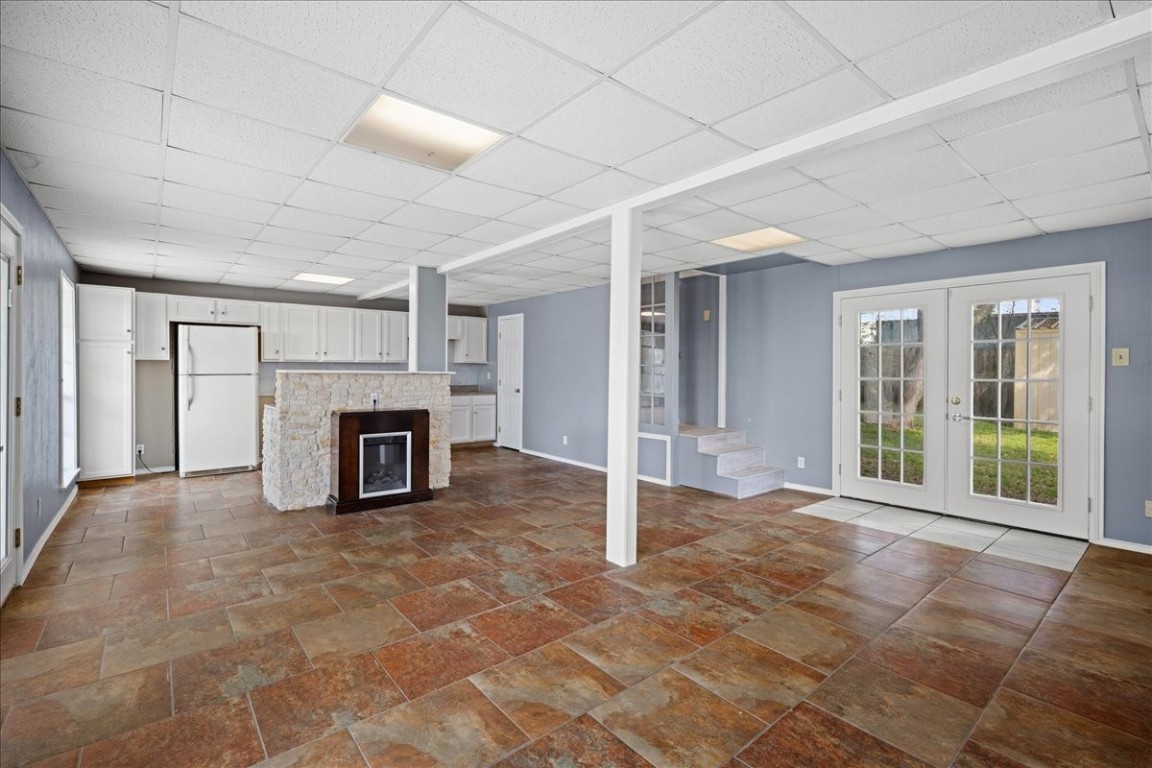103 Emile Street Brenham, TX 77833 - Photo 6 of 22 a view of an empty room with a fireplace