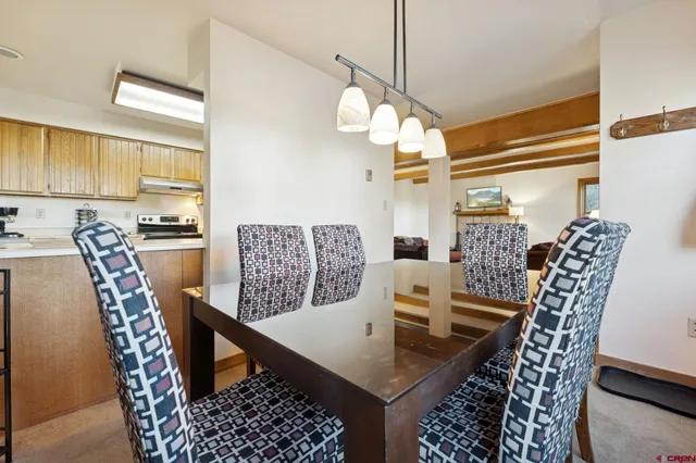 a view of a dining table and chairs