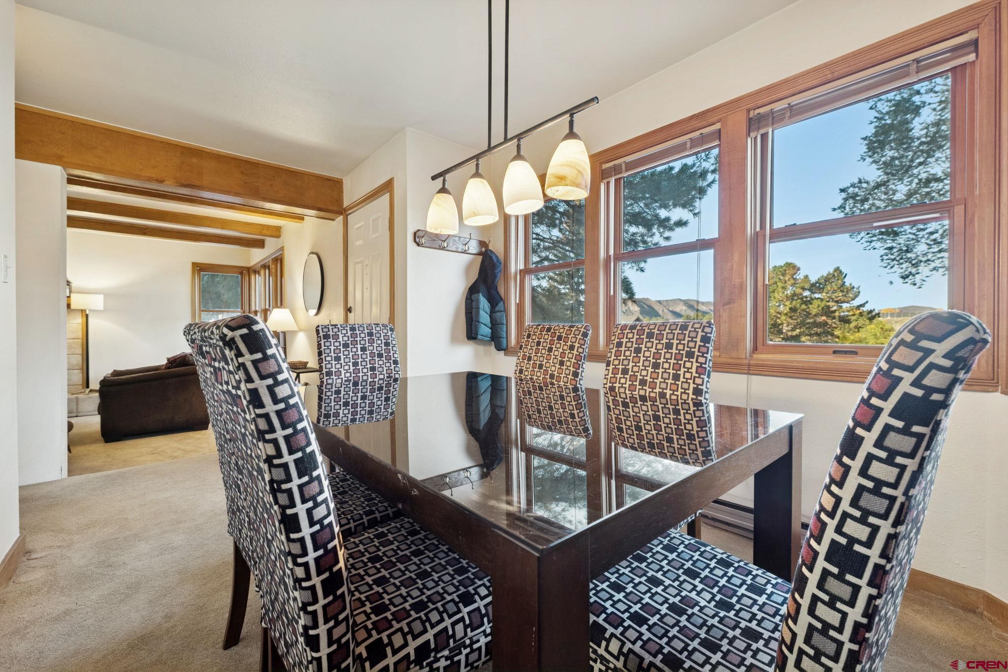 6 Ferringway Circle, Unit 18 Durango, CO 81301 - Photo 11 of 39 a view of a dining room with furniture window and wooden floor