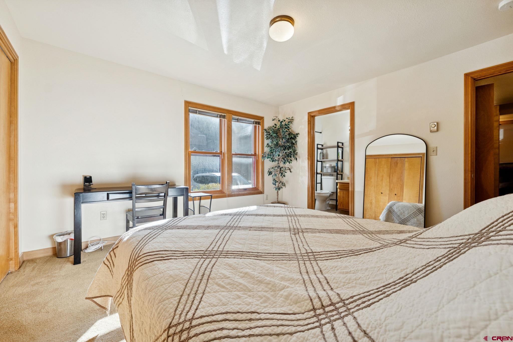 6 Ferringway Circle, Unit 18 Durango, CO 81301 - Photo 15 of 39 a bedroom with a bed and a window