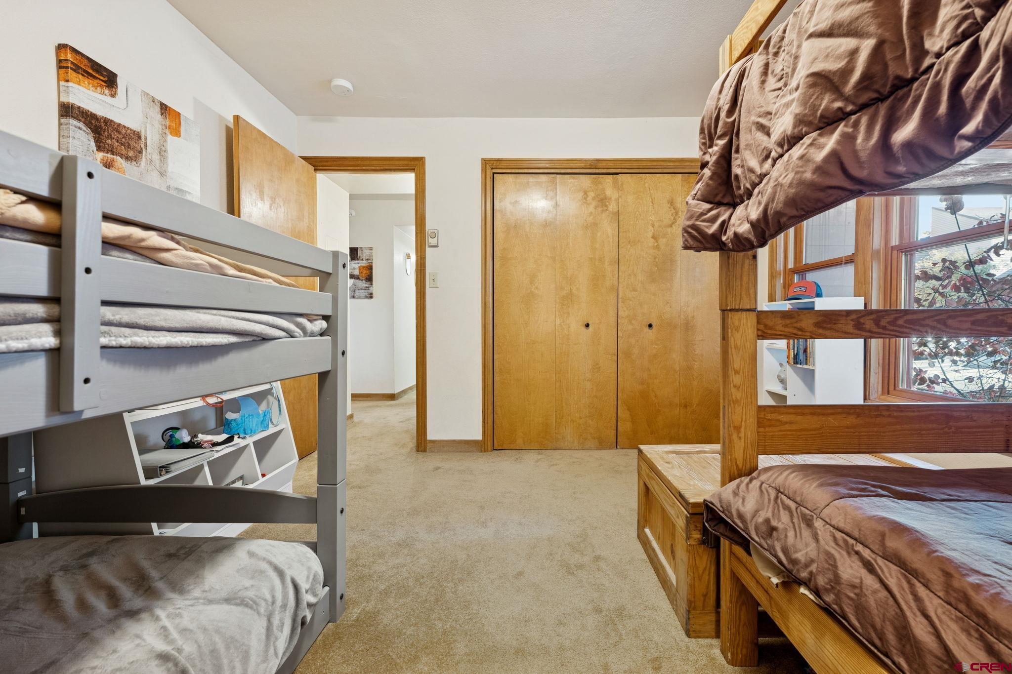 6 Ferringway Circle, Unit 18 Durango, CO 81301 - Photo 19 of 39 a bedroom with a bed and a window