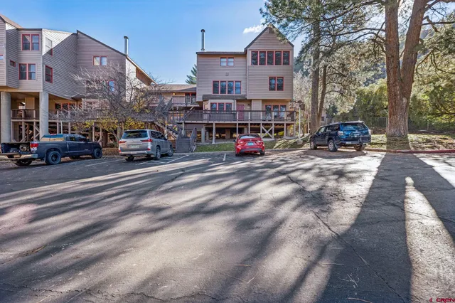 a view of street with parked cars