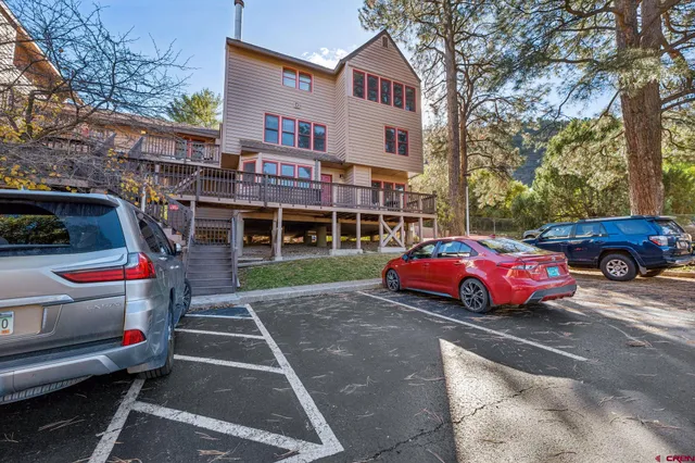 a front view of a house with parking space