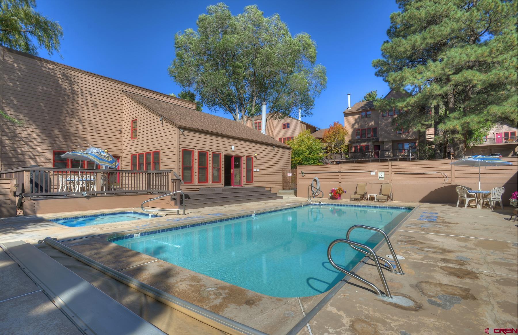 6 Ferringway Circle, Unit 18 Durango, CO 81301 - Photo 32 of 39 a view of a patio with swimming pool table and chairs