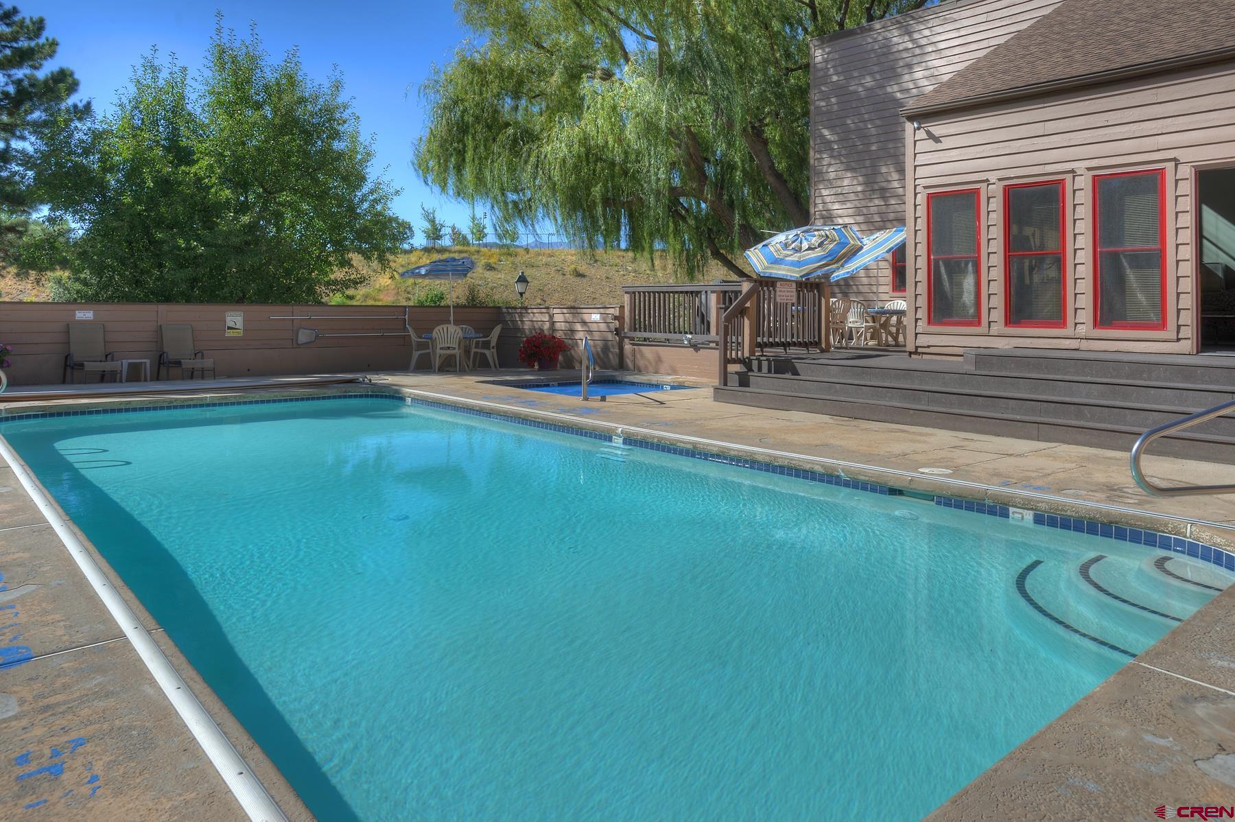 6 Ferringway Circle, Unit 18 Durango, CO 81301 - Photo 33 of 39 a swimming pool with outdoor seating and yard