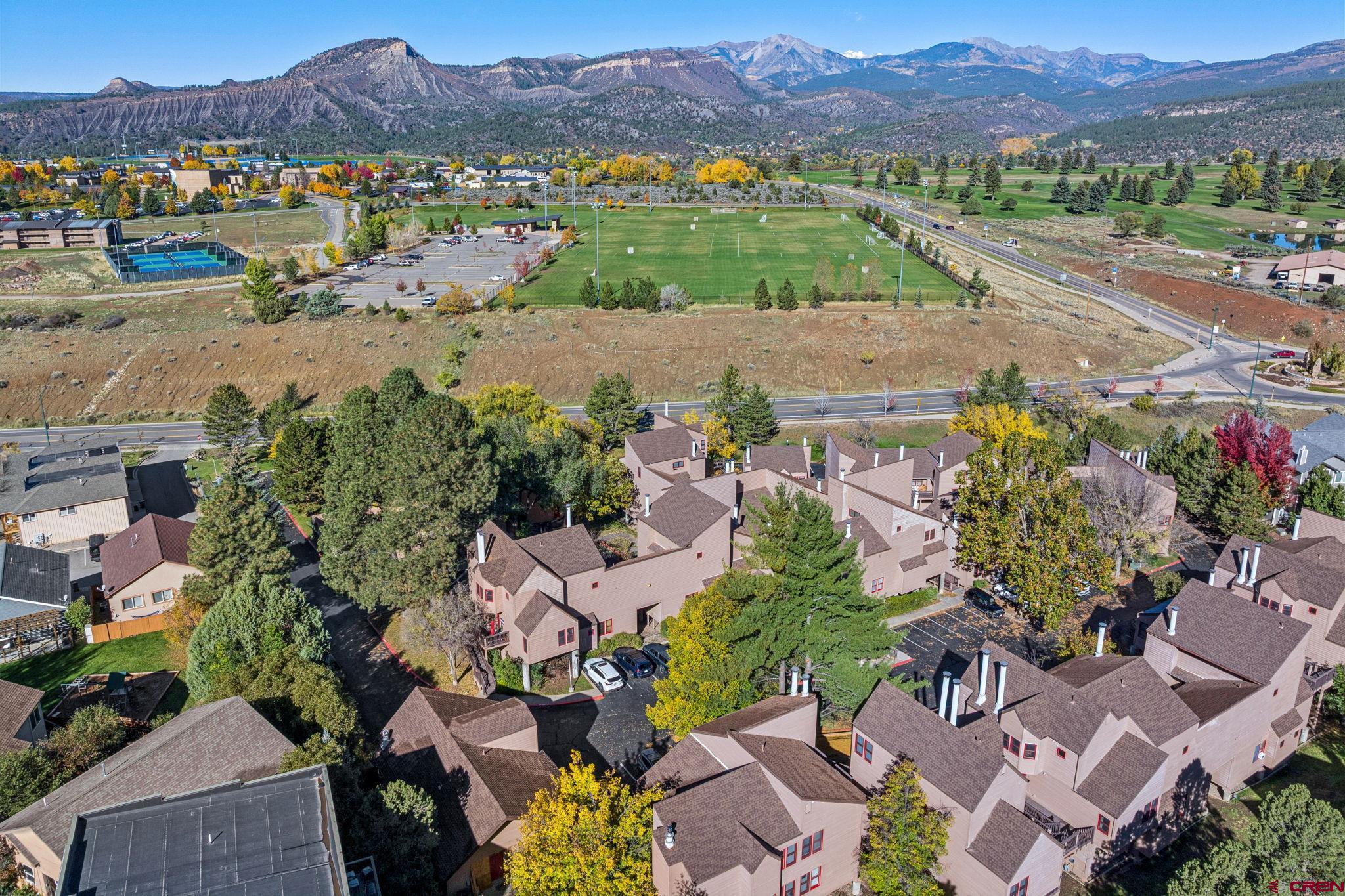 6 Ferringway Circle, Unit 18 Durango, CO 81301 - Photo 38 of 39 an aerial view of a city with lots of residential buildings and mountain view in back