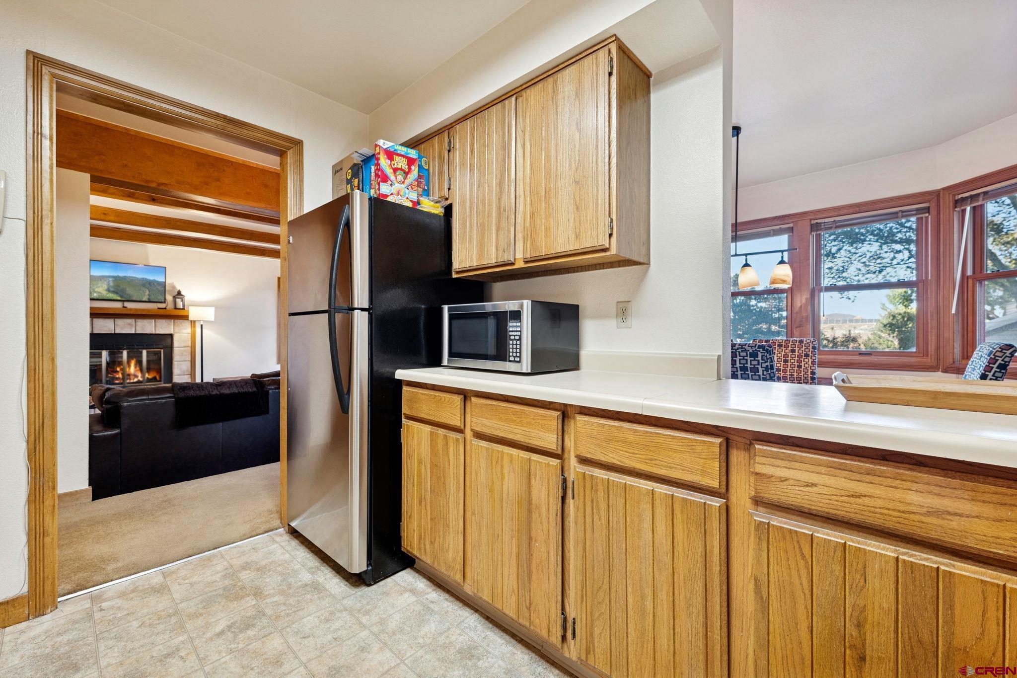 6 Ferringway Circle, Unit 18 Durango, CO 81301 - Photo 7 of 39 a kitchen with stainless steel appliances granite countertop a refrigerator and a sink