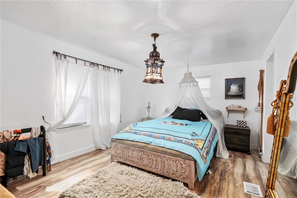 22924 Northwest 91st Court Road Micanopy, FL 32667 - Photo 28 of 95 a bedroom with a bed and a window