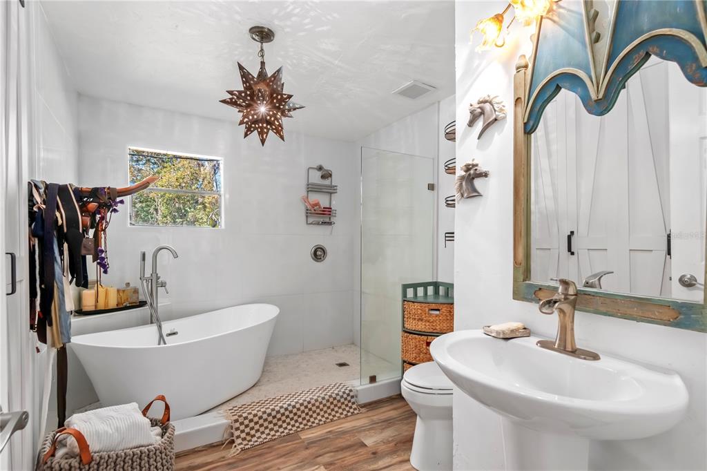 22924 Northwest 91st Court Road Micanopy, FL 32667 - Photo 30 of 95 a bathroom with a sink and a mirror