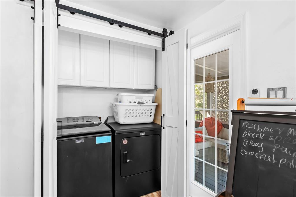 22924 Northwest 91st Court Road Micanopy, FL 32667 - Photo 33 of 95 a utility room with dryer and washer