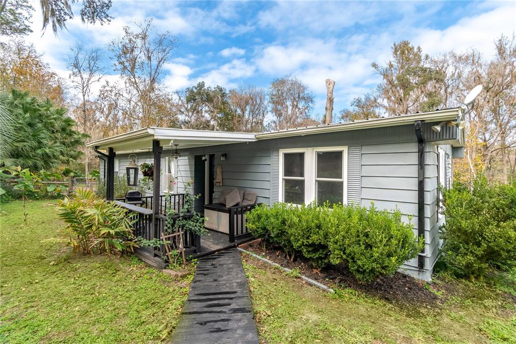 22924 Northwest 91st Court Road Micanopy, FL 32667 - Photo 4 of 95 a view of house with back yard