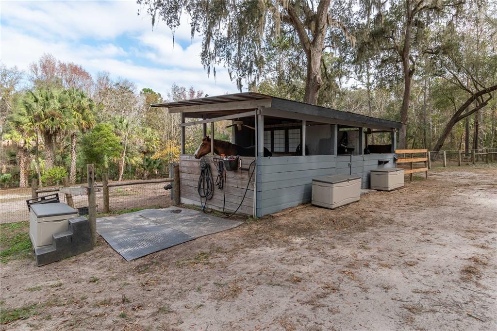22924 Northwest 91st Court Road Micanopy, FL 32667 - Photo 74 of 95 a view of a house with a yard and sitting area