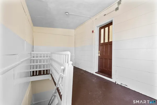 a view of entryway with stairs