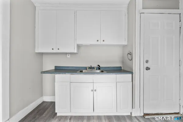 an empty room with wooden floor