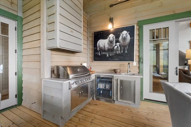 a bathroom with a double vanity sink toilet and shower