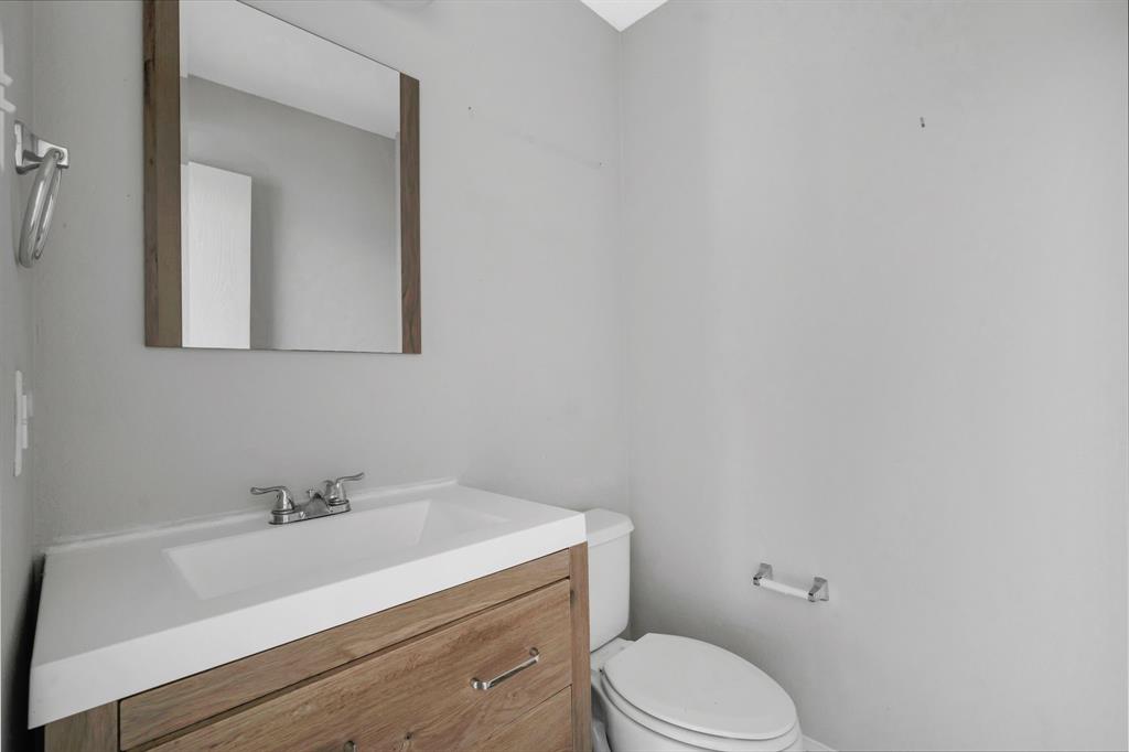 1725 Willow Way Anna, TX 75409 - Photo 17 of 33 a bathroom with a sink a toilet and mirror