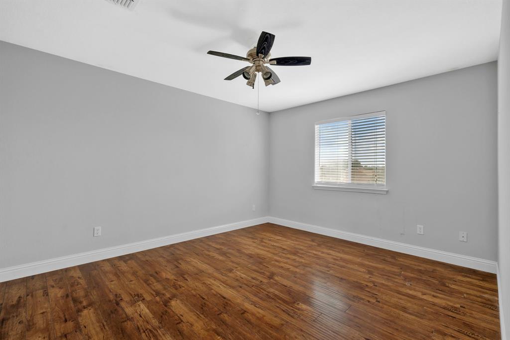 1725 Willow Way Anna, TX 75409 - Photo 27 of 33 wooden floor in an empty room with a window