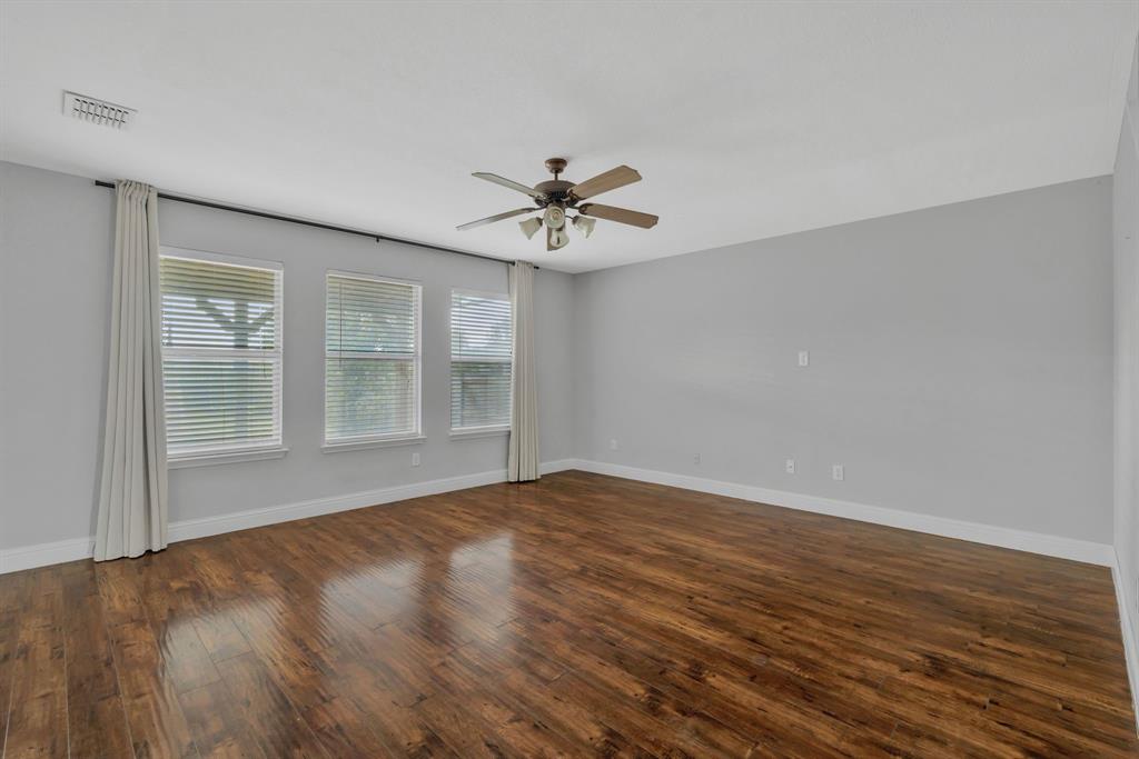 1725 Willow Way Anna, TX 75409 - Photo 10 of 33 wooden floor in an empty room with a window