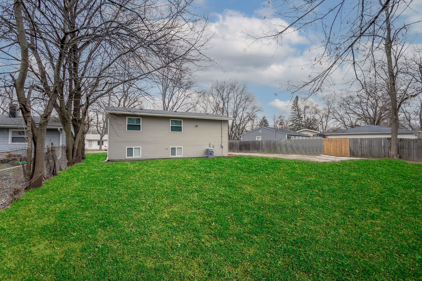 15331 Cherry Lane Markham, IL 60428 - Photo 3 of 13 a front view of house with yard and green space