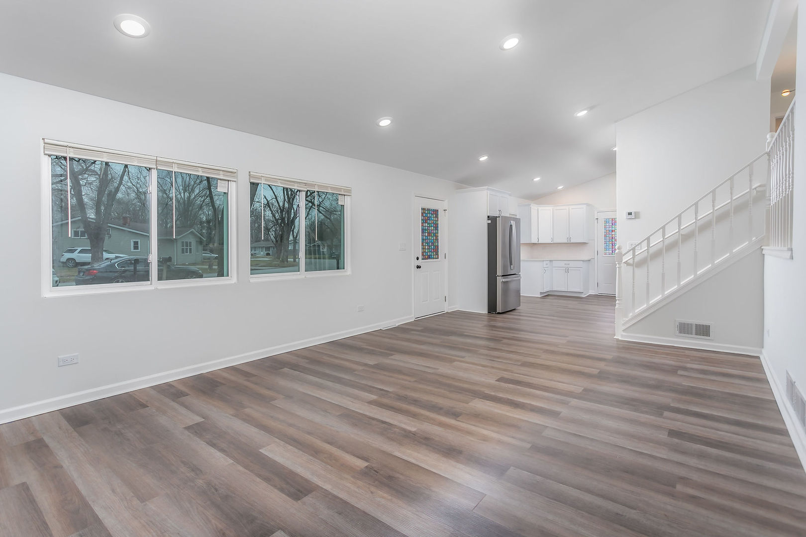 15331 Cherry Lane Markham, IL 60428 - Photo 6 of 13 a view of empty room with wooden floor and windows