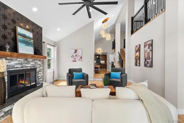 a living room with furniture and a fireplace