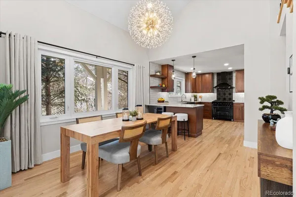 a view of a dining room with furniture window and wooden floor