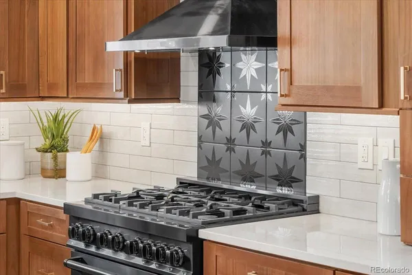 a kitchen with a stove and a microwave