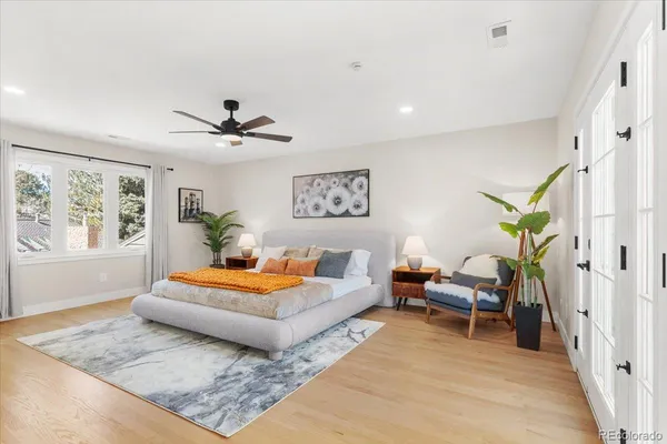 a living room with furniture rug and wooden floor