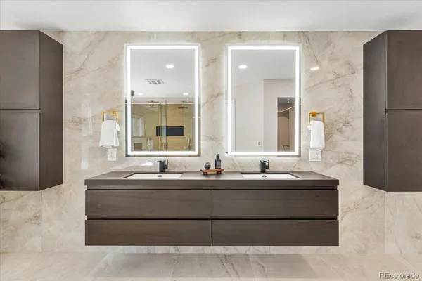 a white bath tub sitting next to a bathroom
