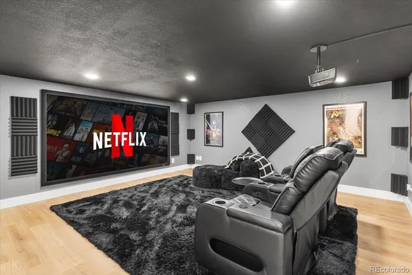 a bathroom with a granite countertop sink mirror and a shower
