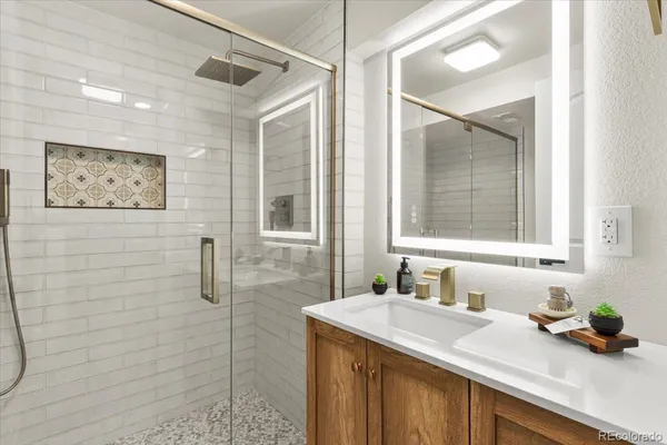 a utility room with cabinets washer and dryer
