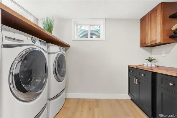 a view of a patio with couches chairs and potted plants