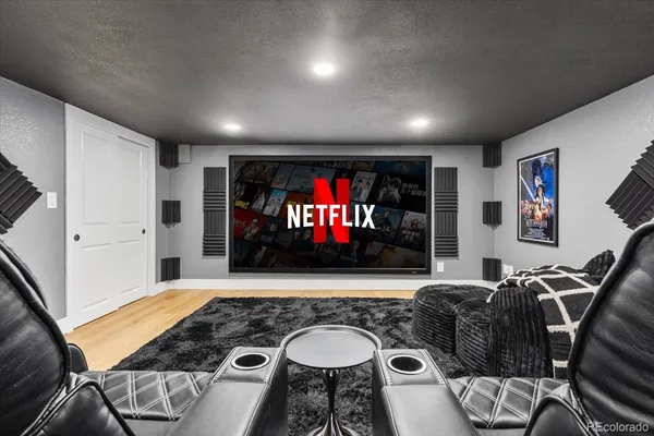 a room with furniture and a flat screen tv