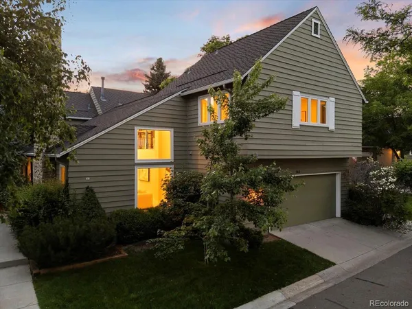 a front view of house with green space