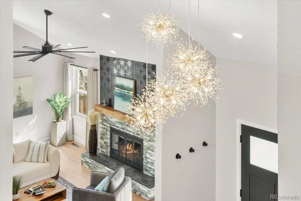 a view of living room with furniture and a chandelier